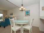 Dining Area with Seating for 4 Also Offers Water Views at 1824 Beachside Tennis